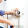 Picture of man installing water heater